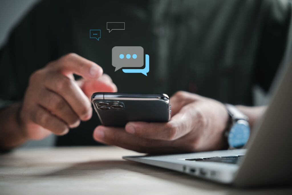 Business owner using messaging on a smartphone